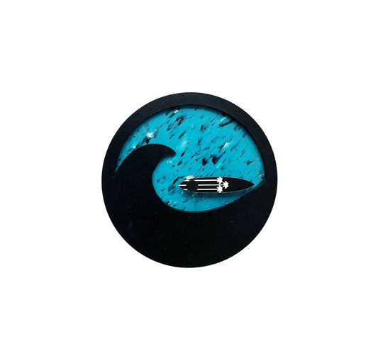 Horloge des marées bleu, ronde avec une grande vague noir en surimpression